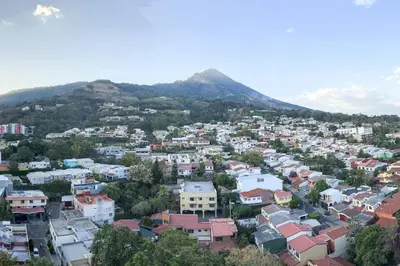 an aerial view of a city with a mountain at Upper Scale and Cozy Apart in the Heart of Escalon in San Salvador