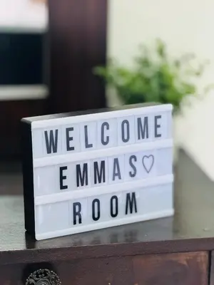 a sign that says welcome to emmaus room at Emmitas room in Juayúa