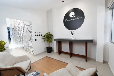 a living room with a table and a balloon at Quaranta Lofts in Antiguo Cuscatlán