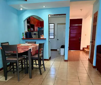 a kitchen and dining room with a table and chairs at casa en la Cima in San Salvador
