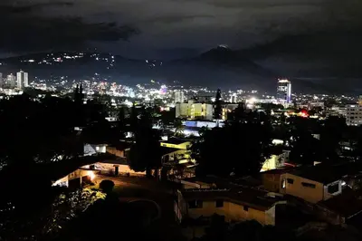 a view of a city at night with lights at Amazing City Views, with Queen Bed and Pool in San Salvador