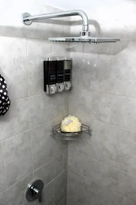 a bathroom with a shower with a towel at Amazing City Views, with Queen Bed and Pool in San Salvador