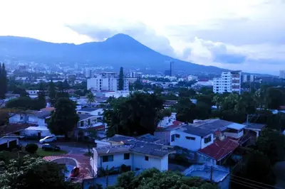 a view of a city with a mountain in the background at Amazing City Views, with Queen Bed and Pool in San Salvador