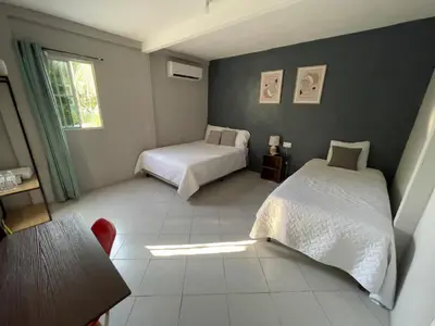 a bedroom with two beds and a window at Habitación cerca del aeropuerto #3 in La Paz