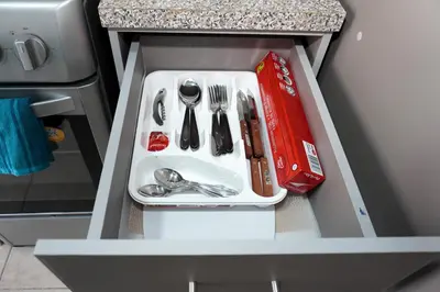 a drawer with silver utensils in a cabinet at La Petite Santa Ana in Santa Ana