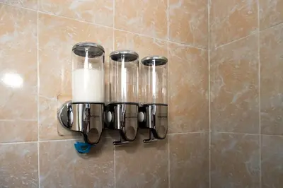 a candle holder on a wall in a bathroom at La Petite Santa Ana in Santa Ana