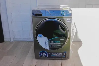 a package of a washing machine sitting on the floor at La Petite Santa Ana in Santa Ana