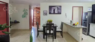 a kitchen and dining room with a table and chairs at San Salvador Mountain & City Views Apartment in San Salvador