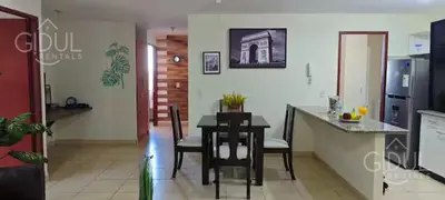 a kitchen and dining room with a table and chairs at San Salvador Mountain & City Views Apartment in San Salvador