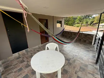 a room with a table and a chair and rope at Mini Room El Mangal B&B in Suchitoto