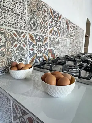 two bowls of eggs on a counter in a kitchen at Urban Nest Hostel in Santa Ana