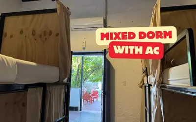 a sign that reads mixed dont with ac in a room at Urban Nest Hostel in Santa Ana