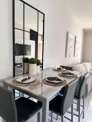 a dining room with a table and chairs at Elegant Modern Tiny Home in San Miguel