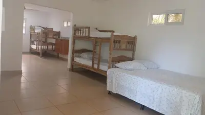 a room with two bunk beds and a bed at Rancho Joya Del Mar in Sonsonate