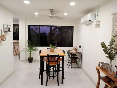 a kitchen and dining room with a table and chairs at La Bella Suite in San Salvador