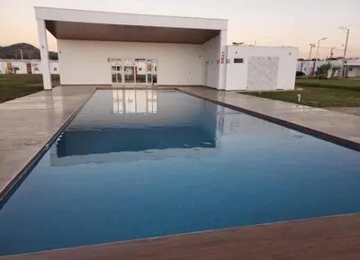 a pool of water in front of a building at Santa Ana Maquilishuat in Santa Ana