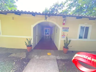an entrance to a building with potted plants at Hotel y Restaurante Ocean Corner in El Zonte