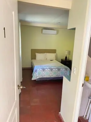 a bedroom with a bed in a room at Hotel y Restaurante Ocean Corner in El Zonte