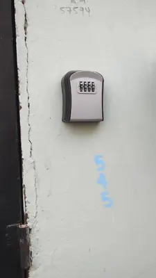 a digital clock on the side of a wall at Casa Dorada in Santa Ana