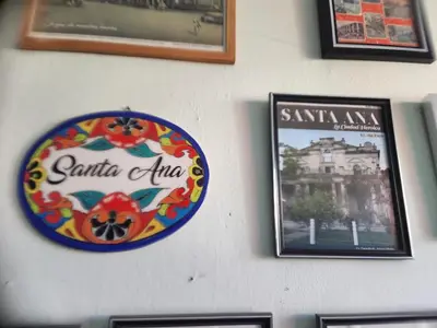 a sign on a wall with pictures of santa ana at Casa Dorada in Santa Ana