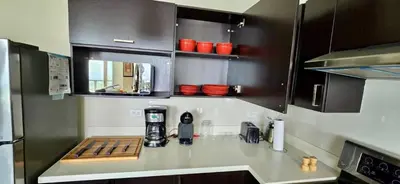 a kitchen with a counter with a coffee maker on it at The Sky View in San Salvador