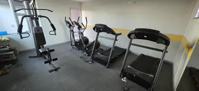 a gym with several exercise bikes in a room at The Sky View in San Salvador