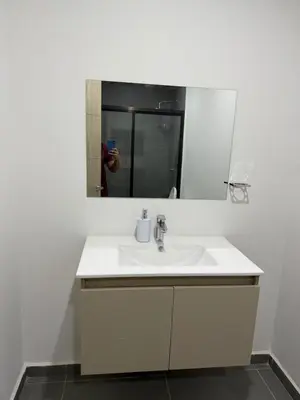a bathroom with a white sink and a mirror at Paradise Apartment at Gallerias Escalon in Colonia Escalón