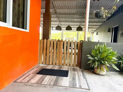 a wooden fence in front of a house at Estero View Beach House in Barra de Santiago