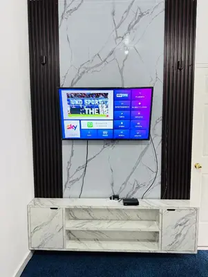 a flat screen tv sitting on a wall at Casa Monaco in San Miguel