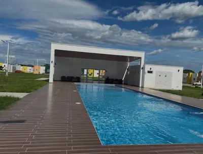 a swimming pool in front of a building at Casa Monaco in San Miguel