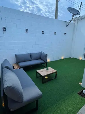 a living room with a couch and a table at Casa Monaco in San Miguel