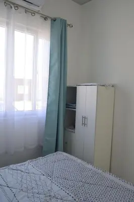 a bedroom with a bed and a window at sophia by aby House in San Miguel
