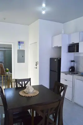 a kitchen and dining room with a table and chairs at sophia by aby House in San Miguel