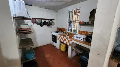 a small kitchen with a stove and a sink at Casita d Playa 1 in La Esmeralda