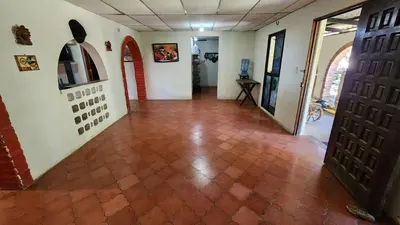 a hallway with a tile floor and two doors at Casita d Playa 1 in La Esmeralda
