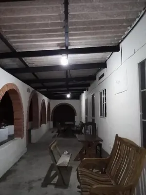 a room with chairs and tables in a building at Casita d Playa 1 in La Esmeralda