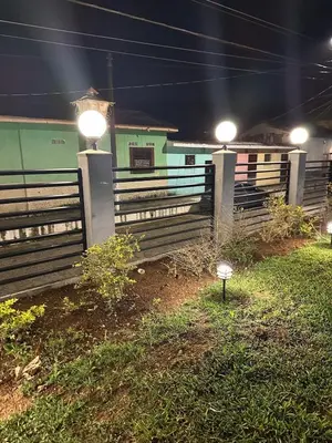 a fence with lights on top of it at night at Moderno & acogedor Apartmento, 2 habitaciones , 4 camas in Concepción de Ataco