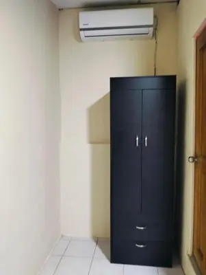 a black cabinet in the corner of a room at Copinol 68 in San Salvador