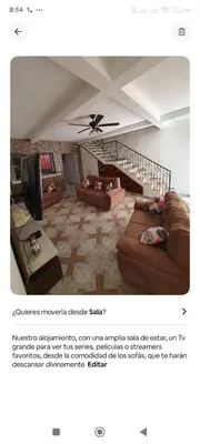 a living room with two couches and a ceiling at Altagracia Altagracia in Santa Ana