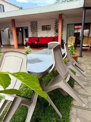 a table and chairs in front of a house at SimpleSerenity Country House in Juayúa