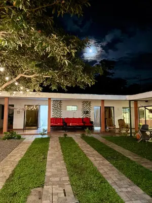 a house with a couch in the yard at night at SimpleSerenity Country House in Juayúa