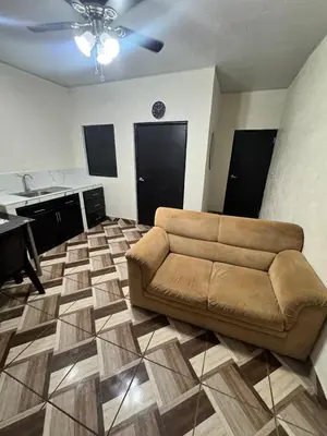 a living room with a couch and a table in it at Cozy house in the center of San Vicente in San Vicente