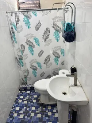 a bathroom with a toilet and a sink at Cozy house in the center of San Vicente in San Vicente