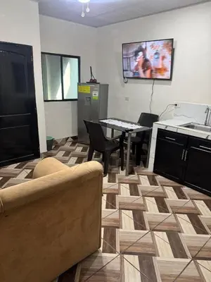 a living room with a couch and a table at Cozy house in the center of San Vicente in San Vicente