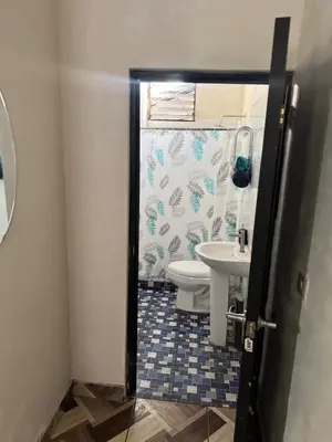 a bathroom with a toilet and a sink at Cozy house in the center of San Vicente in San Vicente