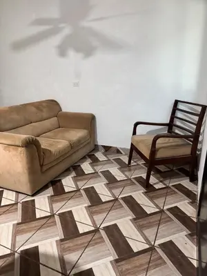 a living room with a couch and a chair at Cozy house in the center of San Vicente in San Vicente