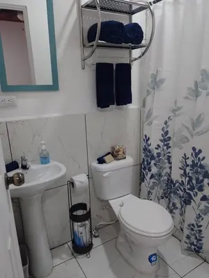 a bathroom with a toilet and a sink at Sunzal Refugio Perfecto-3 in El Sunzal