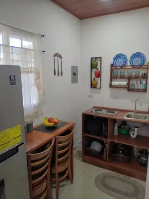 a kitchen with a sink and a counter with chairs at Sunzal Refugio Perfecto-3 in El Sunzal