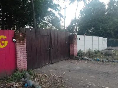 a wooden fence with a wooden door in a yard at Sunzal Refugio Perfecto-3 in El Sunzal