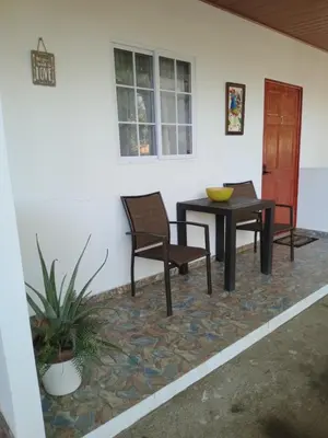 a patio with two chairs and a table in a house at Sunzal Refugio Perfecto-3 in El Sunzal